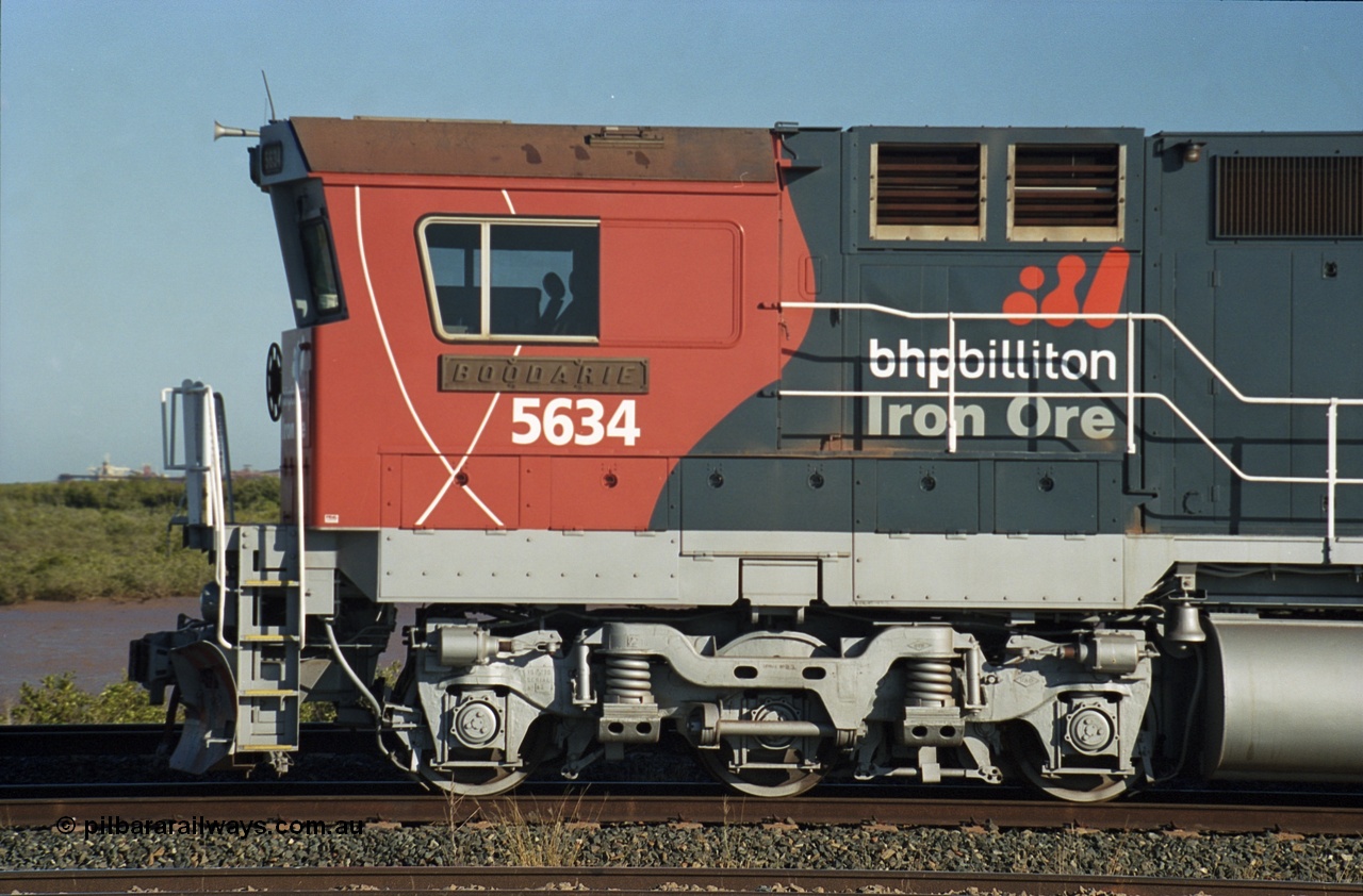 243-24
Nelson Point departure yard, BHP Billiton's CM40-8M unit 5634 'Boodarie' a Goninan WA GE rebuild unit serial 8151-07 / 91-120 in the new 'earth' or 'bubble' livery as it heads up an empty train waiting departure time. August 2003.
Keywords: 5634;Goninan;GE;CM40-8M;8151-07/91-120;rebuild;AE-Goodwin;ALCo;C636;5457;G6027-1;