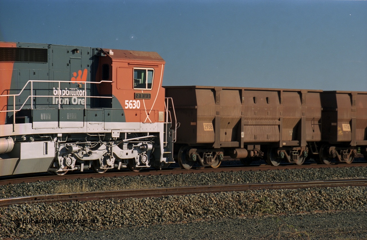 243-26
Nelson Point departure yard, BHP Billiton's CM39-8 unit 5630 'Zeus' serial 5831-09 / 88-079 and built new by Goninan in the new 'earth' or 'bubble' livery as it trails an empty train waiting departure time. August 2003.
Keywords: 5630;Goninan;GE;CM39-8;5831-09/88-079;