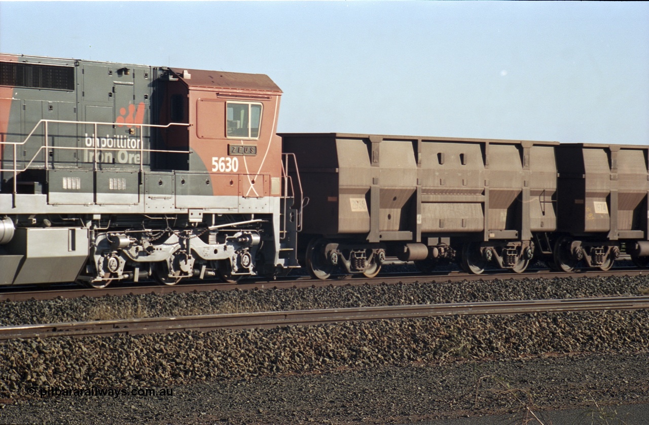 243-28
Nelson Point departure yard, BHP Billiton's CM39-8 unit 5630 'Zeus' serial 5831-09 / 88-079 and built new by Goninan in the new 'earth' or 'bubble' livery as it trails an empty train waiting departure time. August 2003.
Keywords: 5630;Goninan;GE;CM39-8;5831-09/88-079;