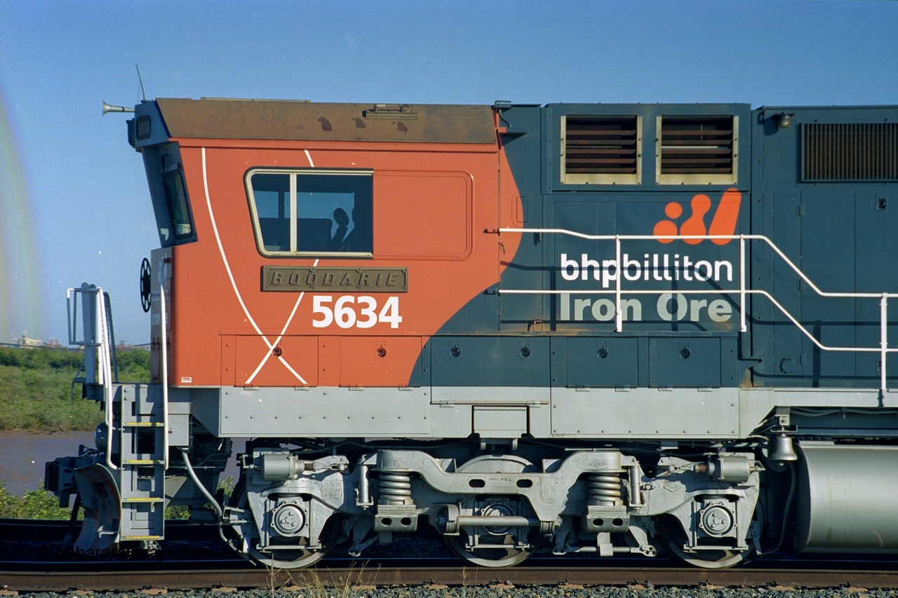 243-30
Nelson Point departure yard, BHP Billiton's CM40-8M unit 5634 'Boodarie' a Goninan WA GE rebuild unit serial 8151-07 / 91-120 in the new 'earth' or 'bubble' livery as it heads up an empty train waiting departure time. August 2003.
Keywords: 5634;Goninan;GE;CM40-8M;8151-07/91-120;rebuild;AE-Goodwin;ALCo;C636;5457;G6027-1;