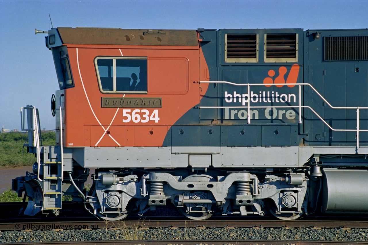 243-31
Nelson Point departure yard, BHP Billiton's CM40-8M unit 5634 'Boodarie' a Goninan WA GE rebuild unit serial 8151-07 / 91-120 in the new 'earth' or 'bubble' livery as it heads up an empty train waiting departure time. August 2003.
Keywords: 5634;Goninan;GE;CM40-8M;8151-07/91-120;rebuild;AE-Goodwin;ALCo;C636;5457;G6027-1;