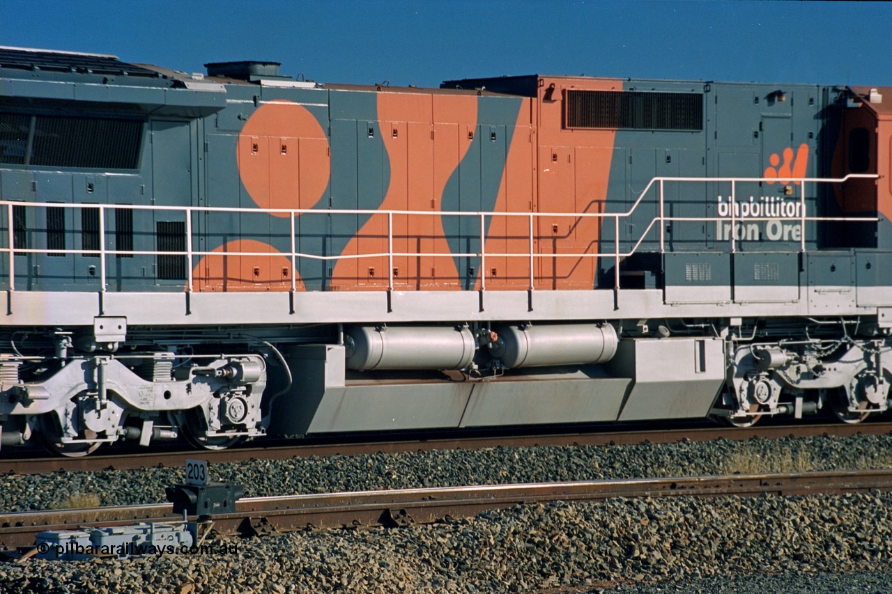 243-34
Nelson Point departure yard, hood view of BHP Billiton's CM39-8 unit 5630 'Zeus' serial 5831-09 / 88-079 and built new by Goninan WA in the new 'earth' or 'bubble' livery as it trails an empty train waiting departure time. August 2003.
Keywords: 5630;Goninan;GE;CM39-8;5831-09/88-079;