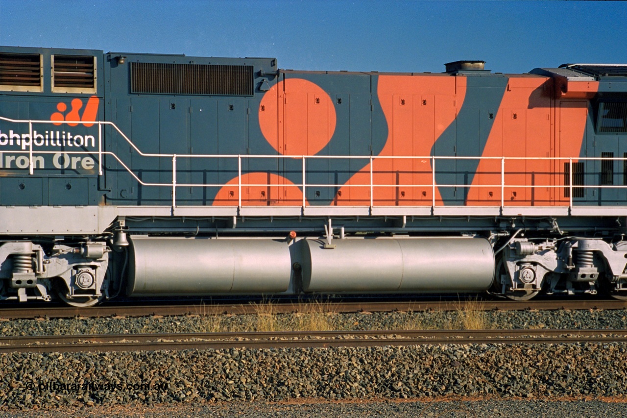 243-35
Nelson Point departure yard, hood view of BHP Billiton's CM40-8M unit 5634 'Boodarie' a Goninan WA GE rebuild unit serial 8151-07 / 91-120 in the new 'earth' or 'bubble' livery as it heads up an empty train waiting departure time. August 2003.
Keywords: 5634;Goninan;GE;CM40-8M;8151-07/91-120;rebuild;AE-Goodwin;ALCo;C636;5457;G6027-1;