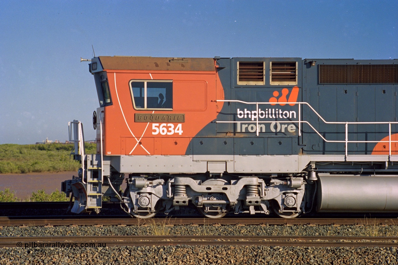 243-37
Nelson Point departure yard, BHP Billiton's CM40-8M unit 5634 'Boodarie' a Goninan WA GE rebuild unit serial 8151-07 / 91-120 in the new 'earth' or 'bubble' livery as it heads up an empty train waiting departure time. August 2003.
Keywords: 5634;Goninan;GE;CM40-8M;8151-07/91-120;rebuild;AE-Goodwin;ALCo;C636;5457;G6027-1;