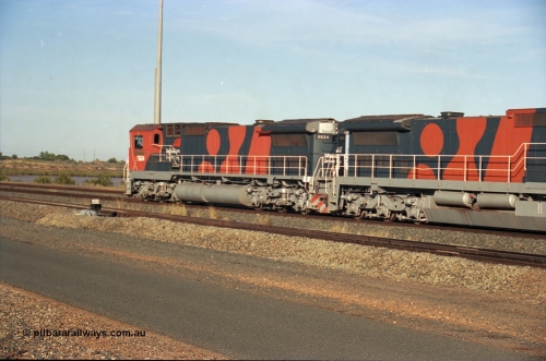 243-08
Nelson Point departure yard, BHP Billiton's CM40-8M unit 5634 'Boodarie' a Goninan WA GE rebuild unit serial 8151-07 / 91-120 in the new 'earth' or 'bubble' livery as it heads up an empty train waiting departure time. August 2003.
Keywords: 5634;Goninan;GE;CM40-8M;8151-07/91-120;rebuild;AE-Goodwin;ALCo;C636;5457;G6027-1;