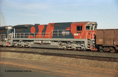 243-10
Nelson Point departure yard, BHP Billiton's CM39-8 unit 5630 'Zeus' serial 5831-09 / 88-079 and built new by Goninan trails CM40-8M unit 5634 both in the new 'earth' or 'bubble' livery as they head up an empty train waiting departure time. August 2003.
Keywords: 5630;Goninan;GE;CM39-8;5831-09/88-079;