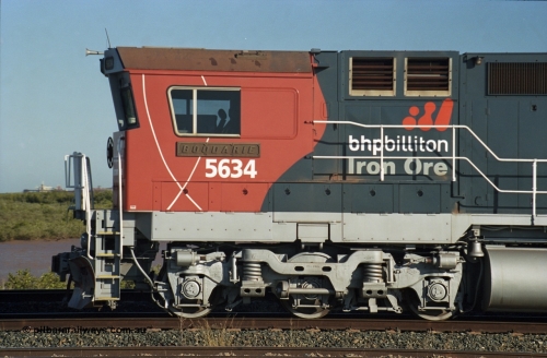 243-24
Nelson Point departure yard, BHP Billiton's CM40-8M unit 5634 'Boodarie' a Goninan WA GE rebuild unit serial 8151-07 / 91-120 in the new 'earth' or 'bubble' livery as it heads up an empty train waiting departure time. August 2003.
Keywords: 5634;Goninan;GE;CM40-8M;8151-07/91-120;rebuild;AE-Goodwin;ALCo;C636;5457;G6027-1;