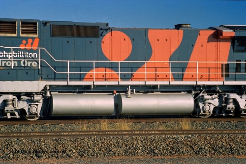 243-35
Nelson Point departure yard, hood view of BHP Billiton's CM40-8M unit 5634 'Boodarie' a Goninan WA GE rebuild unit serial 8151-07 / 91-120 in the new 'earth' or 'bubble' livery as it heads up an empty train waiting departure time. August 2003.
Keywords: 5634;Goninan;GE;CM40-8M;8151-07/91-120;rebuild;AE-Goodwin;ALCo;C636;5457;G6027-1;