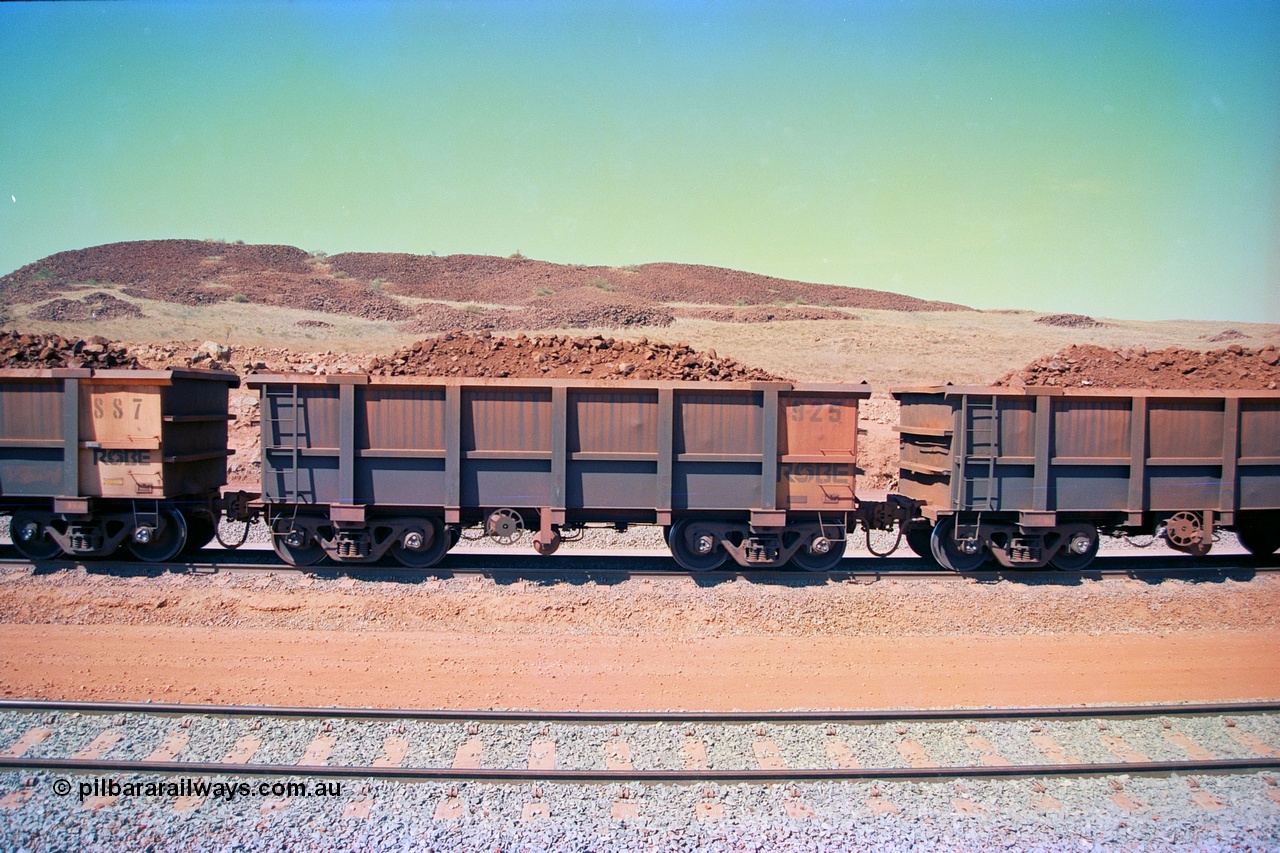 246-33
Cape Lambert, a Robe River loaded Deepdale train on the mainline with waggon 925 a Centurion Industries WA build. The ore is a ROM product and will be dumped over the gyratory crusher to be correctly sized. 22nd May 2002.
Keywords: 925;Centurion-Industries-WA;J-series;
