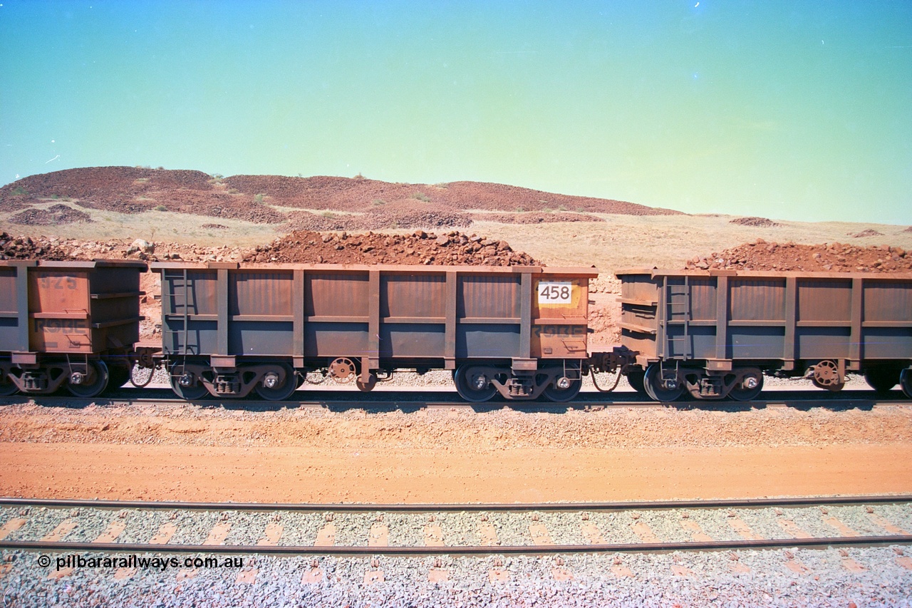 246-34
Cape Lambert, a Robe River loaded Deepdale train on the mainline with waggon 458 a Tomlinson Steel WA build. The ore is a ROM product and will be dumped over the gyratory crusher to be correctly sized. 22nd May 2002.
Keywords: 458;Tomlinson-Steel-WA;J-series;
