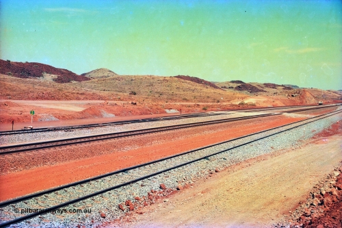 246-02
Cape Lambert, view of the then new extension to the south for the West Angelas mine was coming on stream, the siding furthest from the camera will become a compressor waggon holding road while the original line or Mainline is the second from the camera, with the car dumper one Empty Car line closest, and what becomes the car dumper two Loaded Car line is third. 22nd May 2002.
