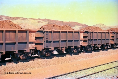 246-29
Cape Lambert, a Robe River loaded Deepdale train rolls along the mainline with the normal 202 waggons which are a mix of builds from Nippon Sharyo Japan and Tomlinson Steel and Centurion Industries both WA companies. The ore is a ROM product and will be dumped over the gyratory crusher to be correctly sized. 22nd May 2002.
