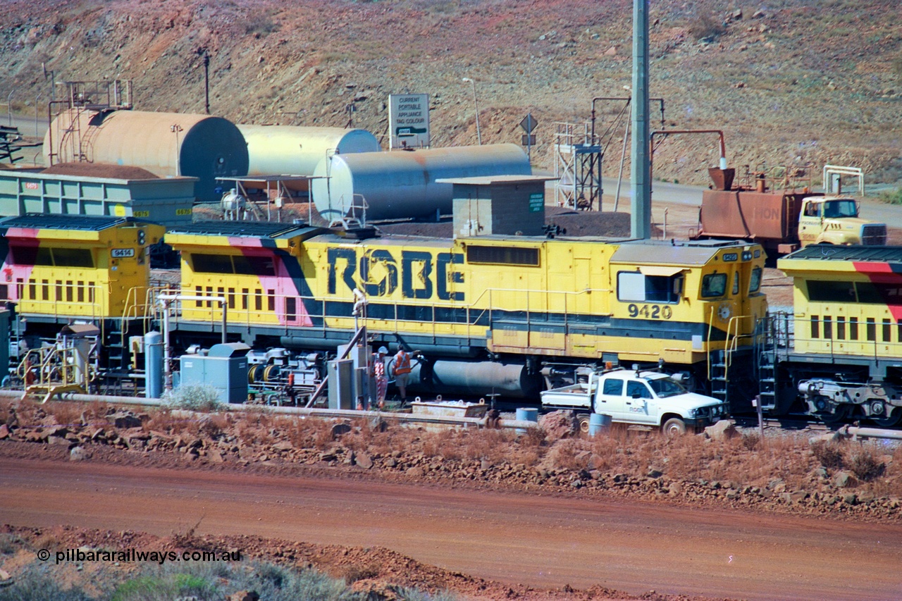 247-07
Cape Lambert fuel point, Robe River locomotive 9420 which is a Goninan WA ALCo to GE rebuild CM40-8M with serial 8109-03 / 91-119 from March 1991 riding on Hi-Ad bogies and was originally an ALCo Schenectady built C630 serial 3486-4 and built new for Chesapeake & Ohio (USA) as their 2103. It is one of four C630 ALCo units purchased in 1974 and delivered to Robe in January 1975. Everything below the frame is ALCo while above is GE and Pilbara Cab. Approximate location of the locos is [url=https://goo.gl/maps/DEynwwkV9PZra5Gm7]here[/url]. 22nd May 2002.
Keywords: 9420;Goninan;GE;CM40-8M;8109-03/91-119;rebuild;ALCo;C630;3486-4;C+O;2103;