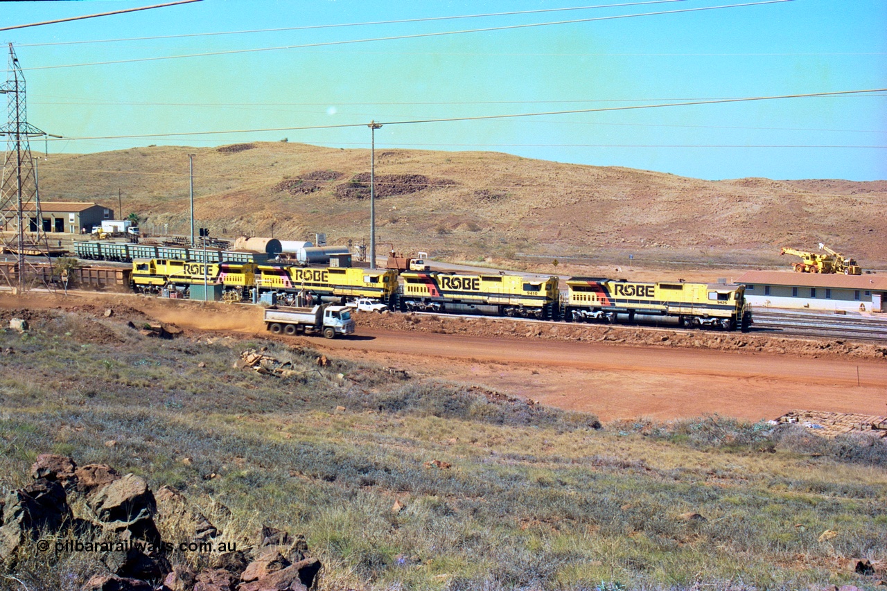 247-13
Cape Lambert overview of the fuel point, with a brace of four CM40-8M rebuilds finishing up refuelling before departing with another empty train. The workshops are to the left of the picture. Where I'm standing to take the picture is now all stockpile. Approximate location of photo is [url=https://goo.gl/maps/B9F4estGGPbd2GrB6]here[/url]. 22nd May 2002.
Keywords: 9425;Goninan;GE;CM40-8M;6266-8/89-85;rebuild;AE-Goodwin;ALCo;M636;G-6041-4;