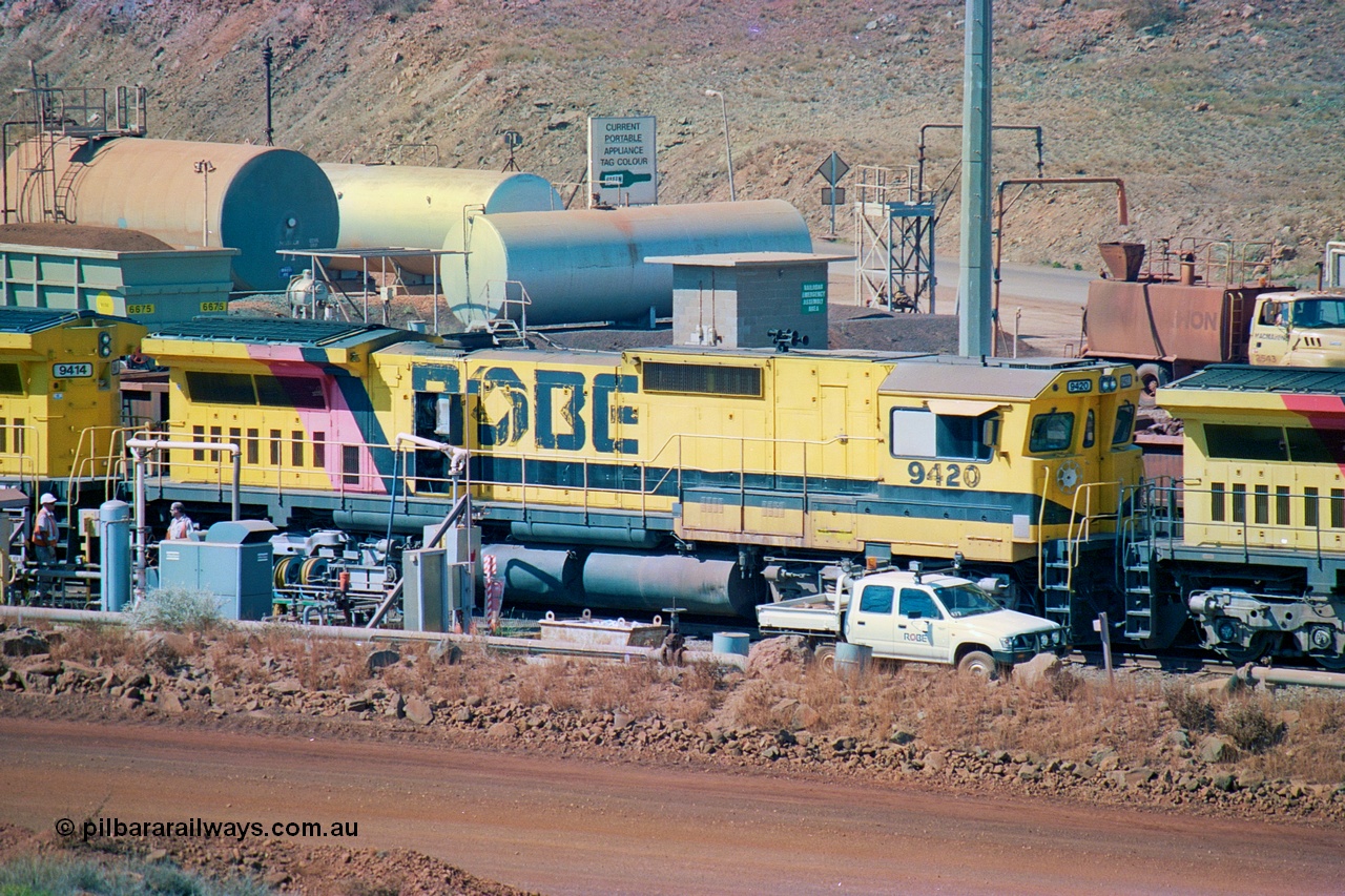 247-26
Cape Lambert fuel point, Robe River locomotive 9420 which is a Goninan WA ALCo to GE rebuild CM40-8M with serial 8109-03 / 91-119 from March 1991 riding on Hi-Ad bogies and was originally an ALCo Schenectady built C630 serial 3486-4 and built new for Chesapeake & Ohio (USA) as their 2103. It is one of four C630 ALCo units purchased in 1974 and delivered to Robe in January 1975. Everything below the frame is ALCo while above is GE and Pilbara Cab. Approximate location of the locos is [url=https://goo.gl/maps/DEynwwkV9PZra5Gm7]here[/url]. 22nd May 2002.
Keywords: 9420;Goninan;GE;CM40-8M;8109-03/91-119;rebuild;ALCo;C630;3486-4;C+O;2103;