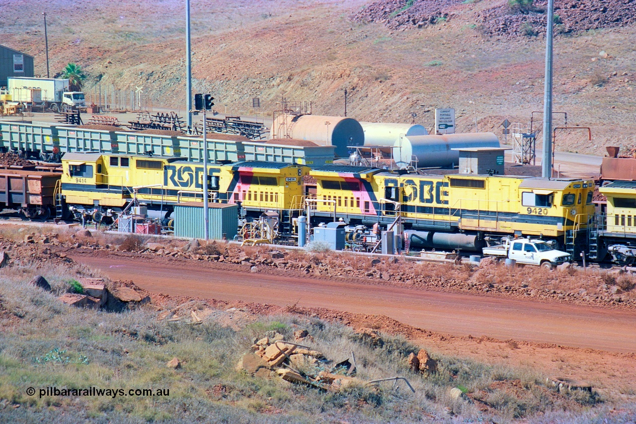 247-27
Cape Lambert fuel point, Robe River locomotive 9420 which is a Goninan WA ALCo to GE rebuild CM40-8M with serial 8109-03 / 91-119 from March 1991 riding on Hi-Ad bogies and was originally an ALCo Schenectady built C630 serial 3486-4 and built new for Chesapeake & Ohio (USA) as their 2103. It is one of four C630 ALCo units purchased in 1974 and delivered to Robe in January 1975. Everything below the frame is ALCo while above is GE and Pilbara Cab. Approximate location of the locos is [url=https://goo.gl/maps/DEynwwkV9PZra5Gm7]here[/url]. 22nd May 2002.
Keywords: 9420;Goninan;GE;CM40-8M;8109-03/91-119;rebuild;ALCo;C630;3486-4;C+O;2103;