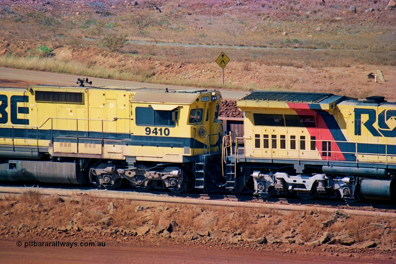 247-29
Cape Lambert fuel point, Robe River locomotive 9410 which is a Goninan WA ALCo to GE rebuild CM40-8M with serial 2160-03 / 96-202 from March 1996 riding on Dofasco bogies and was originally a Comeng NSW built M636 ALCo serial C-6096-5 and built new for Mt Newman Mining (later BHP Iron Ore) in November 1975 and numbered 5500. Everything below the frame is ALCo, with the Comeng build style flat fuel tank, while above is GE and Pilbara Cab. Approximate location of the locos is [url=https://goo.gl/maps/DEynwwkV9PZra5Gm7]here[/url]. 22nd May 2002.
Keywords: 9410;Goninan;GE;CM40-8M;2160-03/96-202;rebuild;Comeng-NSW;ALCo;M636;C-6096-5;
