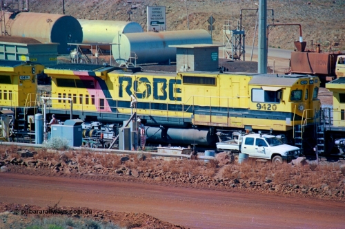 247-09
Cape Lambert fuel point, Robe River locomotive 9420 which is a Goninan WA ALCo to GE rebuild CM40-8M with serial 8109-03 / 91-119 from March 1991 riding on Hi-Ad bogies and was originally an ALCo Schenectady built C630 serial 3486-4 and built new for Chesapeake & Ohio (USA) as their 2103. It is one of four C630 ALCo units purchased in 1974 and delivered to Robe in January 1975. Everything below the frame is ALCo while above is GE and Pilbara Cab. Approximate location of the locos is [url=https://goo.gl/maps/DEynwwkV9PZra5Gm7]here[/url]. 22nd May 2002.
Keywords: 9420;Goninan;GE;CM40-8M;8109-03/91-119;rebuild;ALCo;C630;3486-4;C+O;2103;