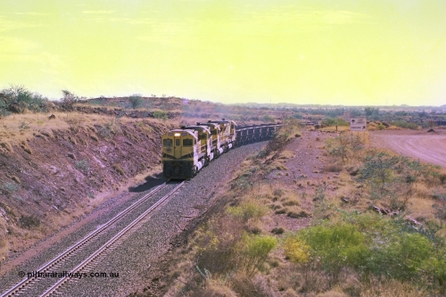 247-30
Near Cooya Pooya at the 37.5 km on the Robe River Cape Lambert line an empty train is about to pass under the town water supply pipeline and pass through Lockyer Gap behind the standard Robe power of quad CM40-8M or Dash 8. Location is [url=https://goo.gl/maps/nLyndU6bg2HA5SZX6]here[/url].22nd May 2002.
Keywords: 9425;Goninan;GE;CM40-8M;6266-8/89-85;rebuild;AE-Goodwin;ALCo;M636;G-6041-4;