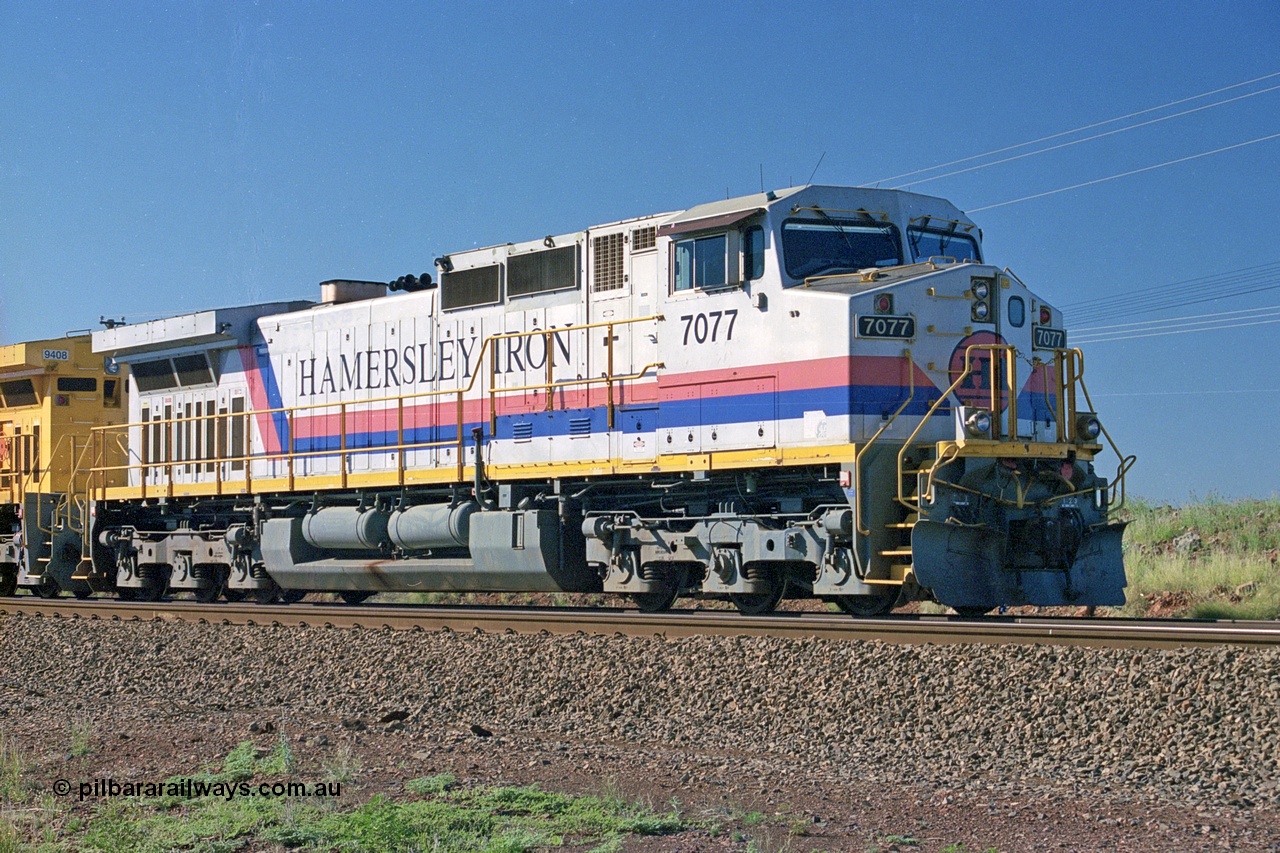 248-02
Dingo Siding on the Hamersley Iron railway at the 39 km with an empty train headed up by a pair of General Electric built Dash 9-44CW units 7077 serial 47756 from the original first order in the Pepsi Can livery from 1994 still looking good some ten years later. Approximate [url=https://goo.gl/maps/Jv752bD5KXv28oUV7]location[/url]. 24th April 2004.
Keywords: 7077;GE;Dash-9-44CW;47756;