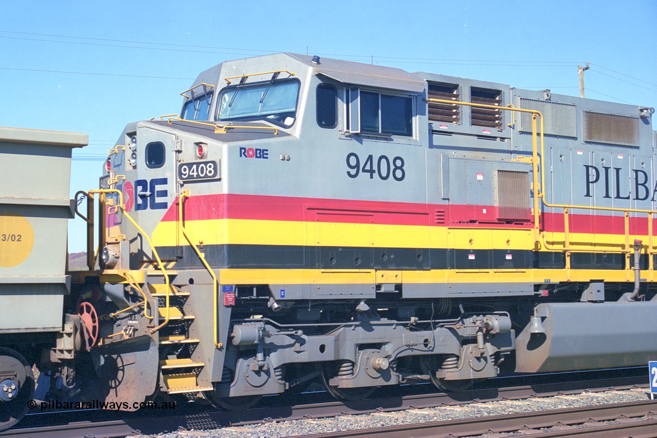 248-07
Dingo Siding on the Hamersley Iron railway at the 39 km with an empty train headed up by a pair of General Electric built Dash 9-44CW units 9408 serial 54158 from the fourth order in 2003 wearing the Pilbara Rail livery with Robe ownership markings. Approximate [url=https://goo.gl/maps/Jv752bD5KXv28oUV7]location[/url]. 24th April 2004.
Keywords: 9408;GE;Dash-9-44CW;54158;