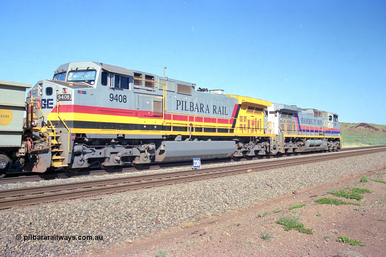 248-08
Dingo Siding on the Hamersley Iron railway at the 39 km with an empty train headed up by a pair of General Electric built Dash 9-44CW units 7077 serial 47756 from the original first order in the Pepsi Can livery and 9408 serial 54158 from the fourth order in the Pilbara Rail livery with Robe ownership markings. Approximate [url=https://goo.gl/maps/Jv752bD5KXv28oUV7]location[/url]. 24th April 2004.
Keywords: 9408;GE;Dash-9-44CW;54158;