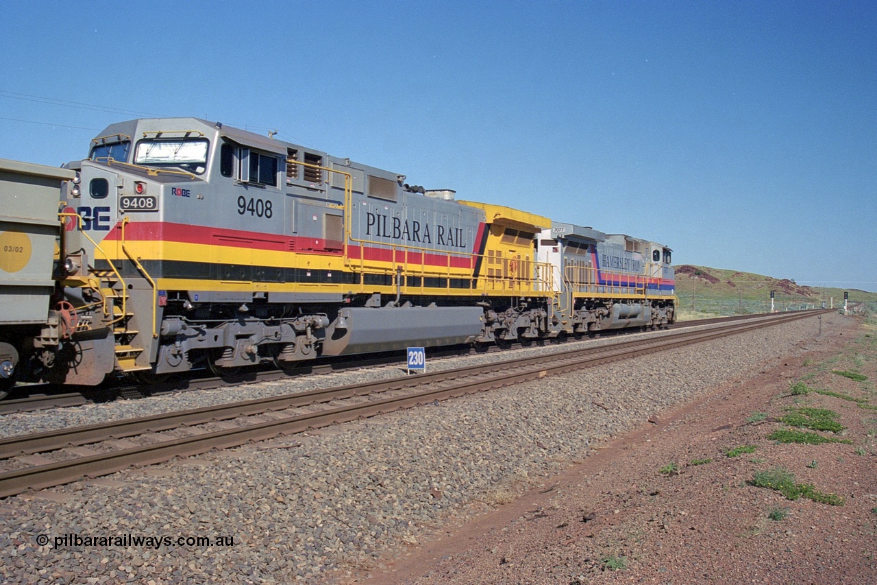 248-09
Dingo Siding on the Hamersley Iron railway at the 39 km with an empty train headed up by a pair of General Electric built Dash 9-44CW units 7077 serial 47756 from the original first order in the Pepsi Can livery and 9408 serial 54158 from the fourth order in the Pilbara Rail livery with Robe ownership markings. The signal marker boards are in the distance. Approximate [url=https://goo.gl/maps/Jv752bD5KXv28oUV7]location[/url]. 24th April 2004.
Keywords: 9408;GE;Dash-9-44CW;54158;