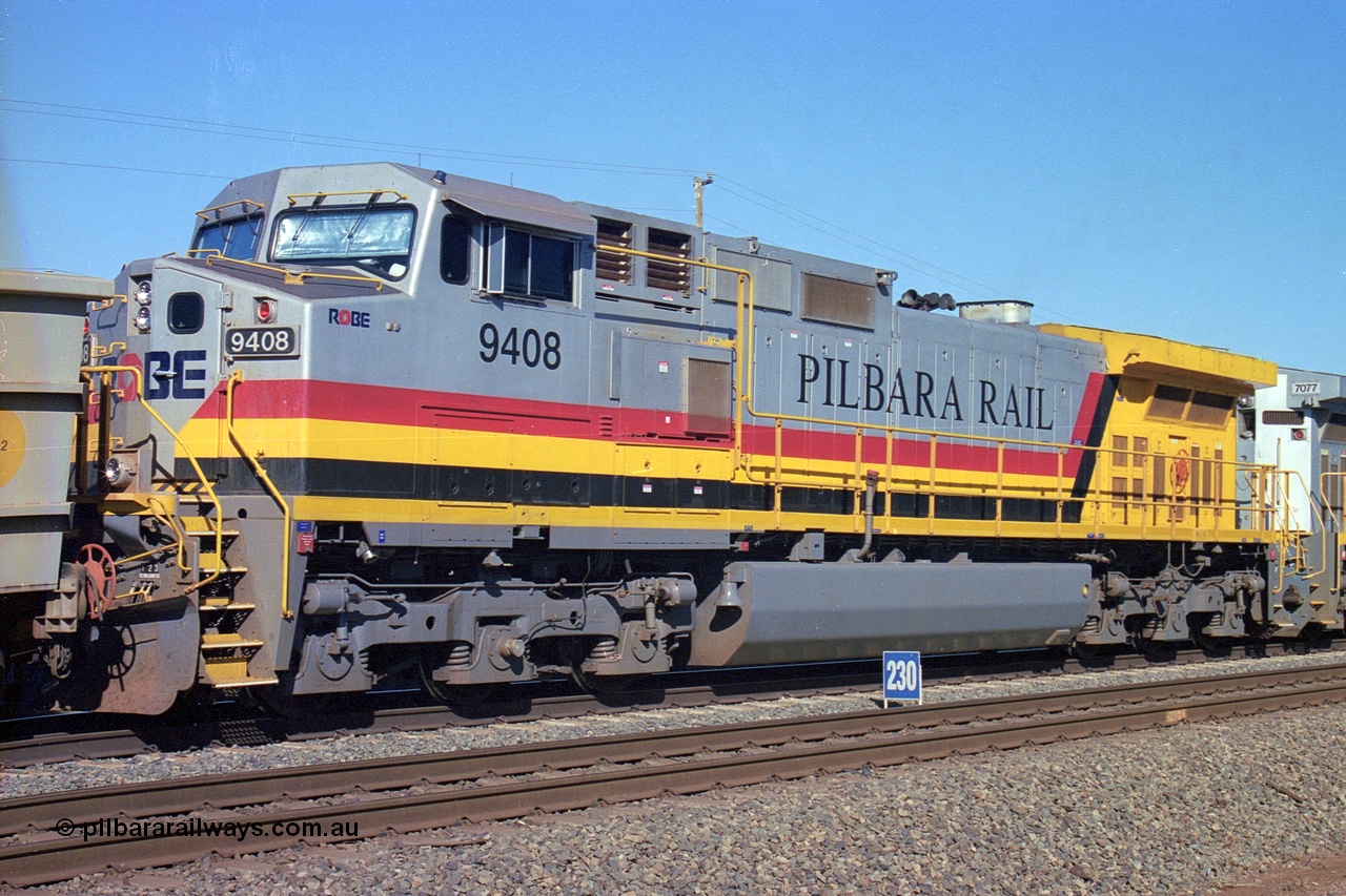 248-10
Dingo Siding on the Hamersley Iron railway at the 39 km with an empty train headed up by a pair of General Electric built Dash 9-44CW units 9408 serial 54158 from the fourth order in 2003 wearing the Pilbara Rail livery with Robe ownership markings. The blue 230 sign is the indication that there is 230 waggons in clear at that point. Approximate [url=https://goo.gl/maps/Jv752bD5KXv28oUV7]location[/url]. 24th April 2004.
Keywords: 9408;GE;Dash-9-44CW;54158;