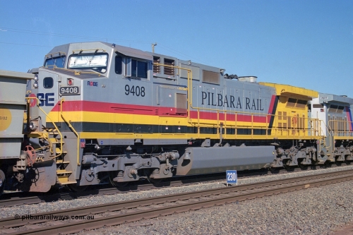 248-06
Dingo Siding on the Hamersley Iron railway at the 39 km with an empty train headed up by a pair of General Electric built Dash 9-44CW units 9408 serial 54158 from the fourth order in 2003 wearing the Pilbara Rail livery with Robe ownership markings. The blue 230 sign is the indication that there is 230 waggons in clear at that point. Approximate [url=https://goo.gl/maps/Jv752bD5KXv28oUV7]location[/url]. April 24, 2004.
Keywords: 9408;GE;Dash-9-44CW;54158;