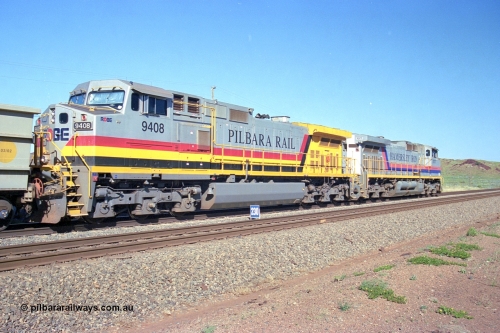 248-08
Dingo Siding on the Hamersley Iron railway at the 39 km with an empty train headed up by a pair of General Electric built Dash 9-44CW units 7077 serial 47756 from the original first order in the Pepsi Can livery and 9408 serial 54158 from the fourth order in the Pilbara Rail livery with Robe ownership markings. Approximate [url=https://goo.gl/maps/Jv752bD5KXv28oUV7]location[/url]. April 24, 2004.
Keywords: 9408;GE;Dash-9-44CW;54158;