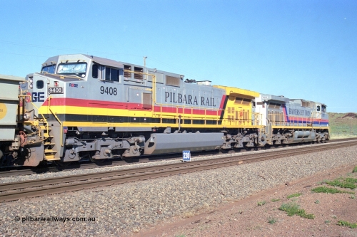 248-11
Dingo Siding on the Hamersley Iron railway at the 39 km with an empty train headed up by a pair of General Electric built Dash 9-44CW units 7077 serial 47756 from the original first order in the Pepsi Can livery and 9408 serial 54158 from the fourth order in the Pilbara Rail livery with Robe ownership markings. Approximate [url=https://goo.gl/maps/Jv752bD5KXv28oUV7]location[/url]. April 24, 2004.
Keywords: 9408;GE;Dash-9-44CW;54158;