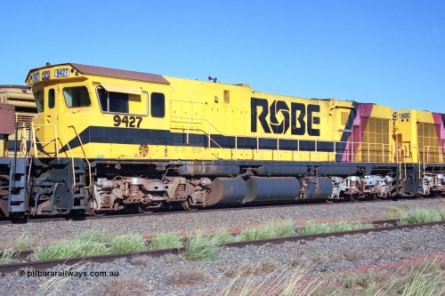 248-17
Seven Mile yard, stored Robe River ALCo locomotives at the south end of the Hamersley Iron Seven Mile yard on roads N2 and N3. On road N2 is 9427 a Comeng WA C636R rebuild from ALCo Schenectady NY model C636 serial 3499-2 originally built in January 1968 for Pennsylvania Railroad as #6331, Penn Central 6331 and finally Conrail 6781. Purchased in 1986 and rebuilt by Comeng WA into C636R before delivery to Robe in January 1987. This loco also went on to become DR 8403 for construction of FMG's railway in 2007-08. Approximate [url=https://goo.gl/maps/CXwAreRPb2RymQ9m9]location[/url]. April 24, 2004.
Keywords: 9427;Comeng-WA;C636R;WA143-2;rebuild;ALCo;Schenectady-NY;C636;Conrail;6781;3499-2;