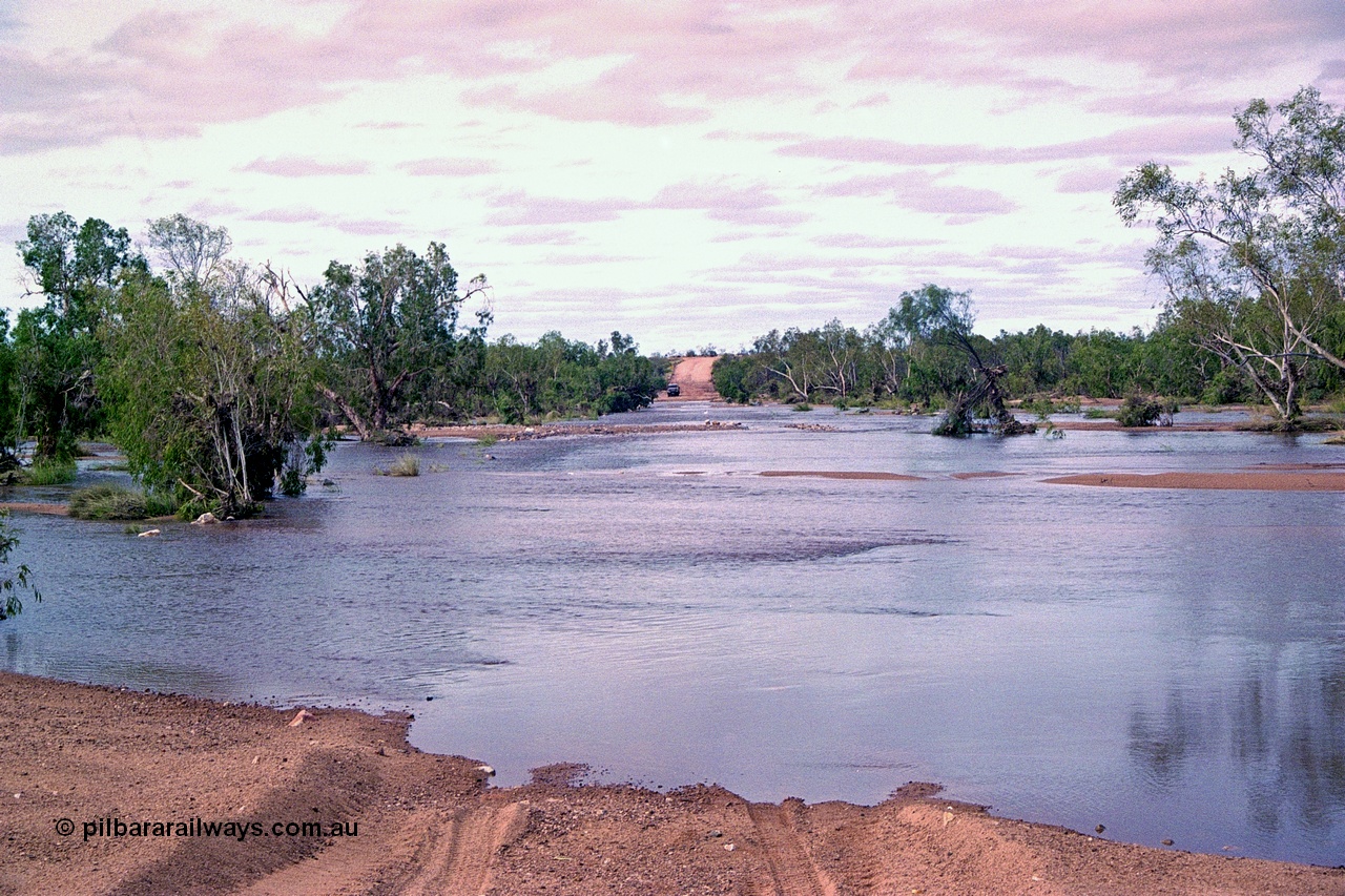 249-01
Yule River road crossing on the former Hedland - Wittenoom Road in flood after Tropical Cyclone John in December 1999. Approximate [url=https://goo.gl/maps/7rbsJE678d4i18MB9]location[/url].
