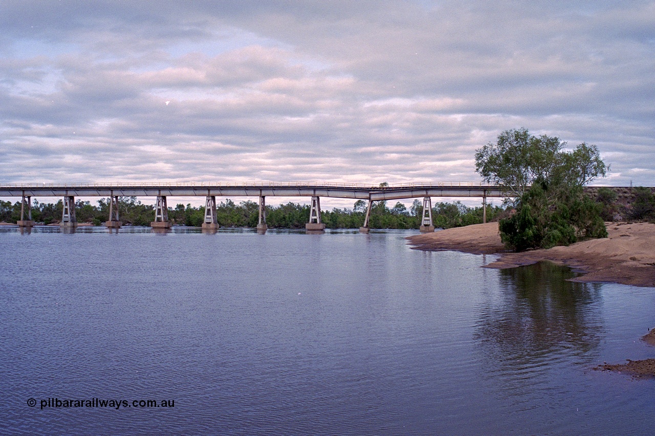 249-09
Yule River bridge looking east upstream the third pier from the southern end was undermined by flood waters from Tropical Cyclone John in December 1999. The rail line was closed for two weeks while repairs were effected. Approximate [url=https://goo.gl/maps/phCWr8u1xnuBdzwj6]location[/url].
