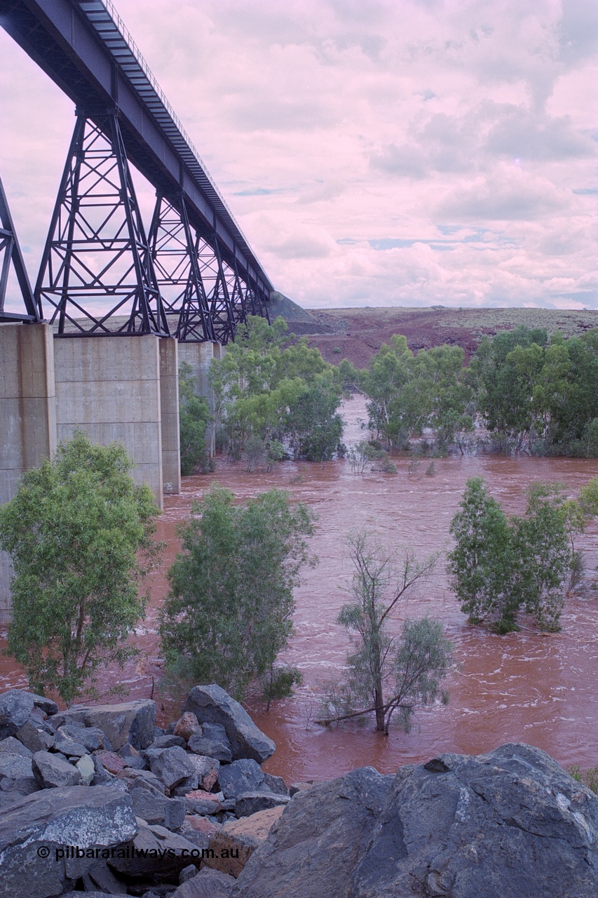 249-21
Fortescue River Bridge on the Robe River line at the 115.8 km in flood looking south following Cyclone John on 18th December 1999. Approximate [url=https://goo.gl/maps/CDTmtMLJewGrMq699]location[/url].
