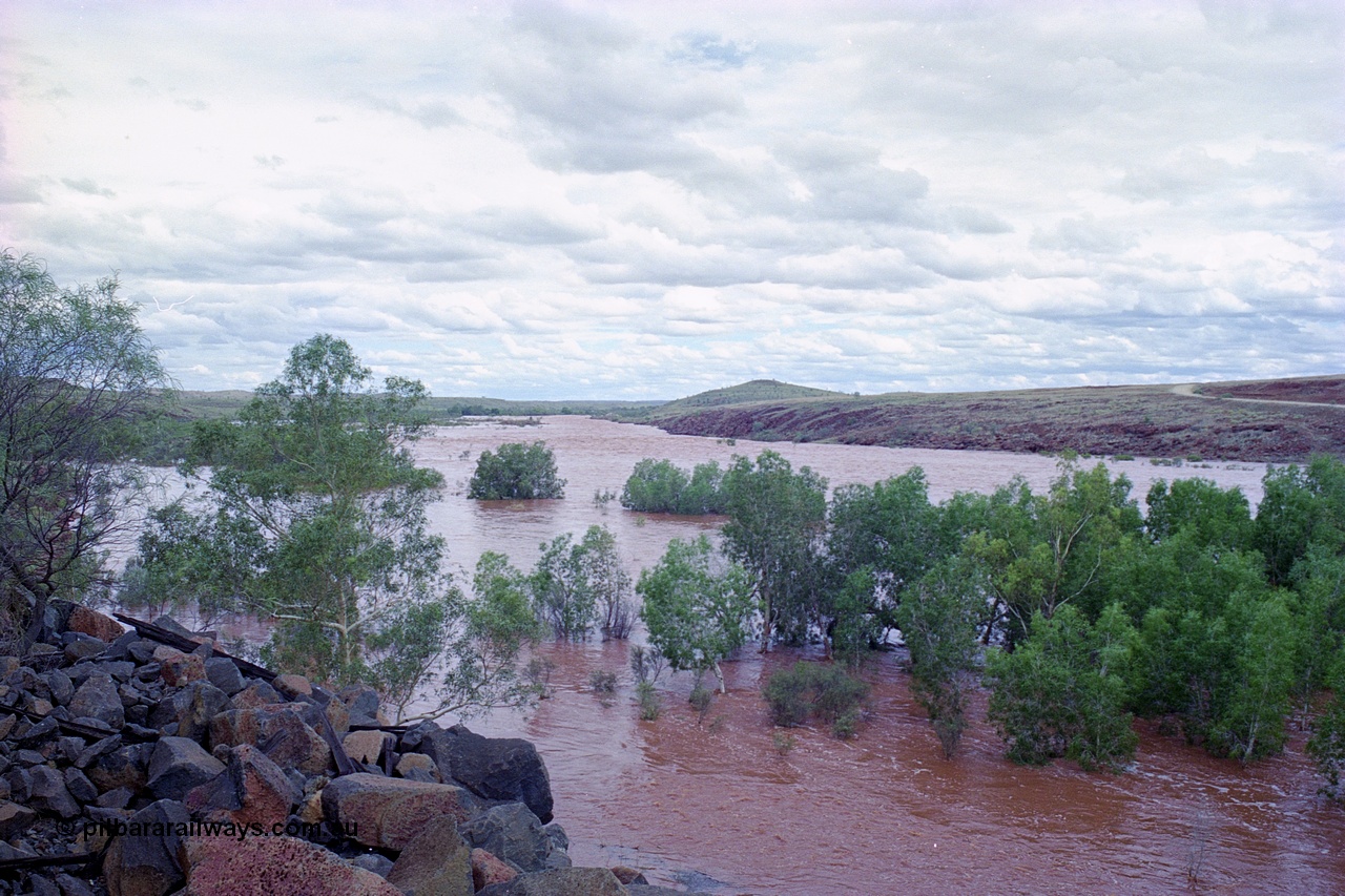 249-22
Fortescue River Bridge on the Robe River line at the 115.8 km in flood looking upstream following Cyclone John on 18th December 1999. Approximate [url=https://goo.gl/maps/3bQRYnLXf8JXCtvu7]location[/url].
