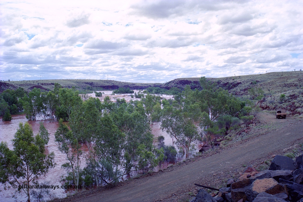 249-23
Fortescue River Bridge on the Robe River line at the 115.8 km in flood looking downstream to the west following Cyclone John on 18th December 1999. Approximate [url=https://goo.gl/maps/CDTmtMLJewGrMq699]location[/url].
