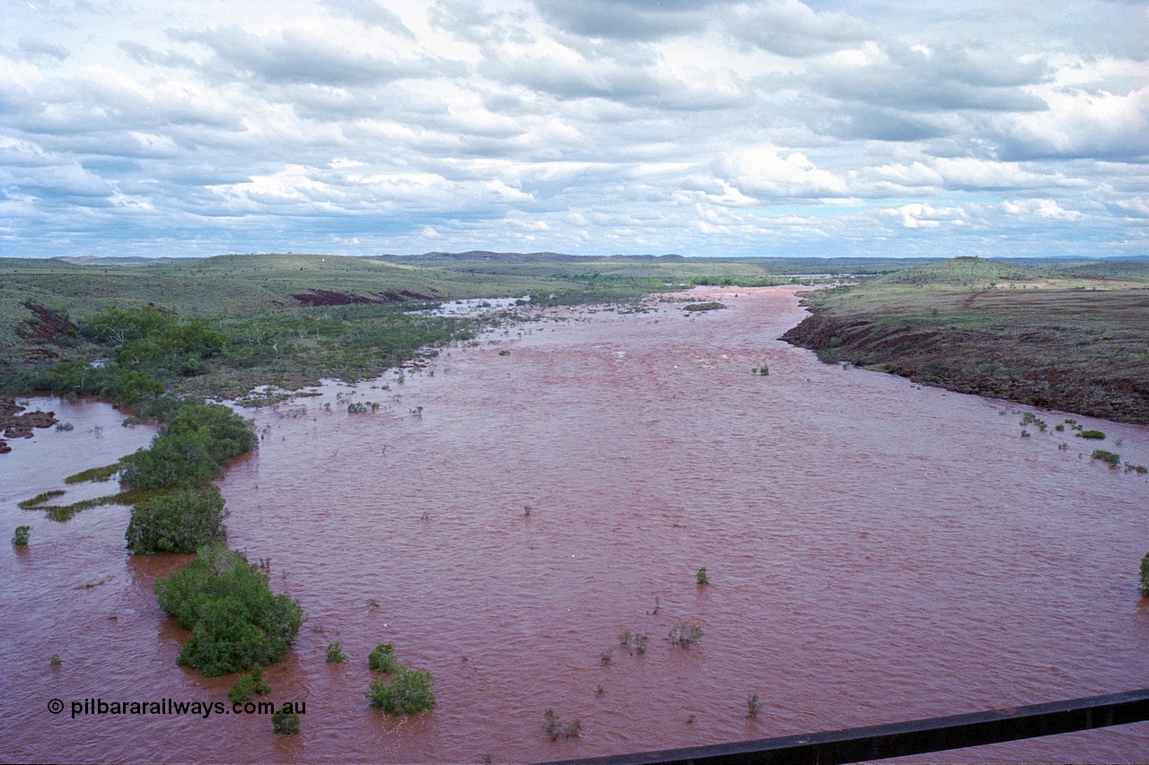 249-25
Fortescue River Bridge on the Robe River line at the 115.8 km in flood looking upstream to the east from the middle of the bridge following Cyclone John on 18th December 1999. Approximate [url=https://goo.gl/maps/x9Cwp468FXgohtvK8]location[/url].
