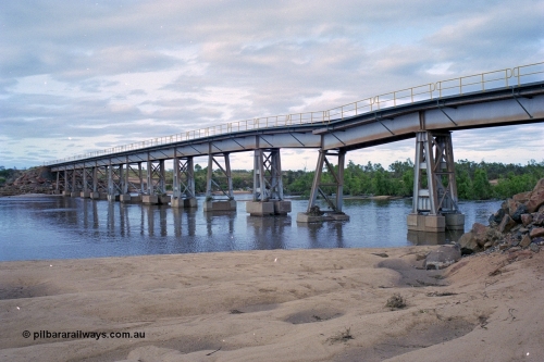 249-07
Yule River bridge looking north east upstream the third pier from the southern end was undermined by flood waters from Tropical Cyclone John in December 1999. The rail line was closed for two weeks while repairs were effected. Approximate [url=https://goo.gl/maps/phCWr8u1xnuBdzwj6]location[/url].

