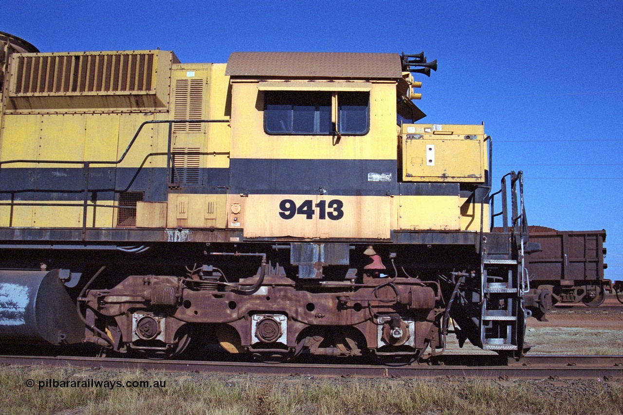 250-27
Cape Lambert yard on the Load Box Spur is recently stored Robe River AE Goodwin built ALCo M636 unit 9413 serial G6060-4 from December 1971, originally numbered 262.004 during construction, renumbered to 86-14-1713 with number boards 1713 and finally 9413. The ducting on the hood is the air to air intercooler modifications. 22nd October 2000.
Keywords: 9413;AE-Goodwin;ALCo;M636;G6060-4;