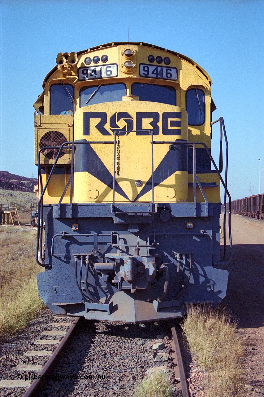 250-29
Cape Lambert Load Box Spur with Robe River remaining ALCo unit recently stored out of service 9416. AE Goodwin built ALCo M636 model with serial G6046-16 was originally built for Hamersley Iron as #4045 and was purchased by Robe right before shipping to Hamersley Iron and entered service in February 1973. 22nd October 2000.
Keywords: 9416;AE-Goodwin;ALCo;M636;G6046-16;