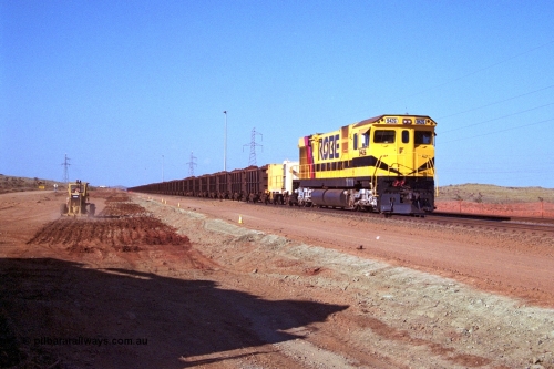 250-23
Cape Lambert South Yard and Robe River's 9426 a Comeng WA rebuild from ALCo Schenectady NY model C636 serial 3499-3 originally built in January 1968 for Pennsylvania as #6332, Penn Central 6332 and finally Conrail 6782. Purchased in 1986 and rebuilt by Comeng WA into C636R before delivery to Robe in November 1986. This loco also went on to become DR 8401 for construction of FMG's railway in 2007-08. Seen here in the South Yard dragging a loaded rake down to the car dumper as yard expansion works are underway to the left. 22nd October 2000.
Keywords: 9426;Comeng-WA;C636R;WA143-1;rebuild;ALCo;Schenectady-NY;C636;Conrail;6782;3499-3;