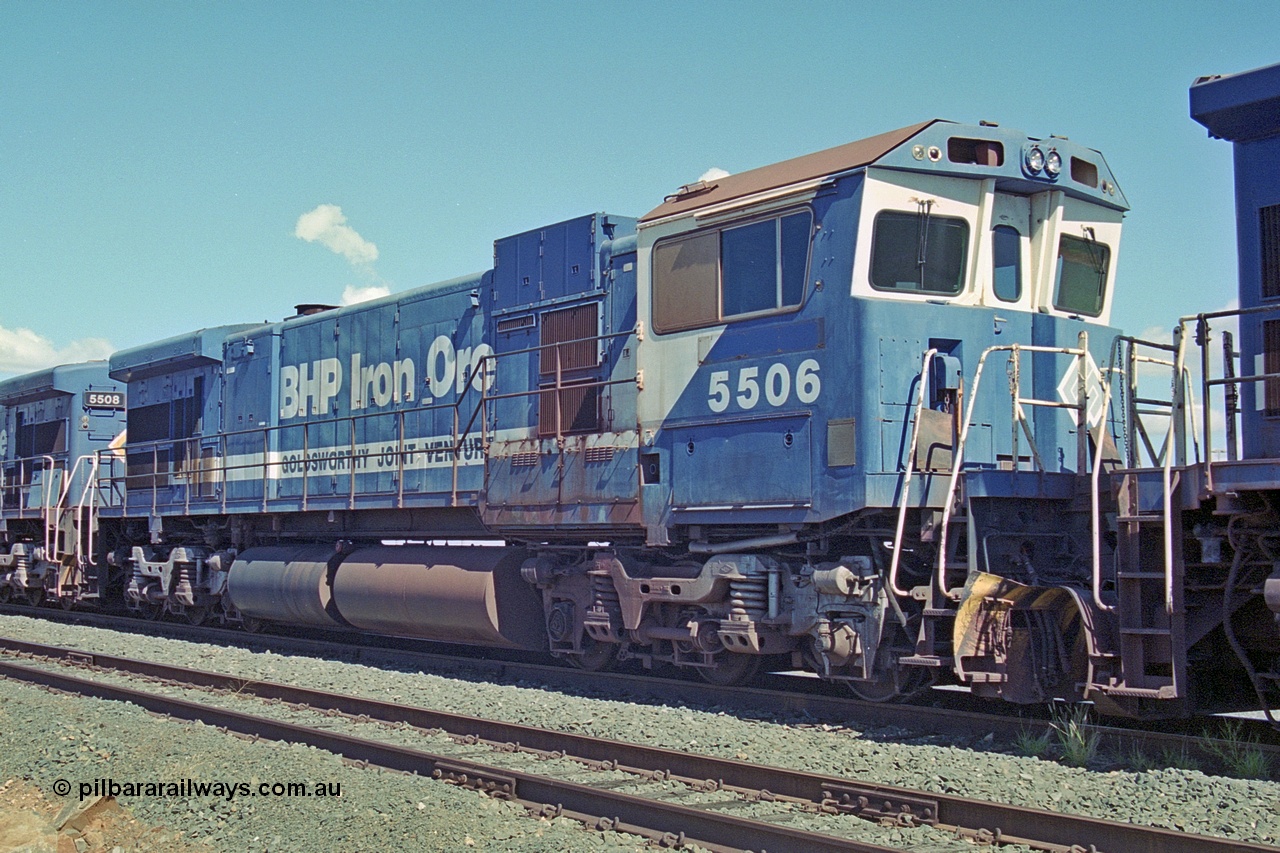 251-02
Nelson Point, BHP's recently retired Goninan WA ALCo C636 to GE C36-7M rebuild unit 5506 awaits its fate. Rebuilt in 1987 at Goninan's Welshpool factory from 1969 AE Goodwin built ALCo C636 with serial number G6012-4 and road number 5455 and assigned new serial number 4839-01 / 87-071. It was delivered in Mt Newman Mining orange and was named Mt Whaleback, then in 1991 5506 emerged in BHP livery carrying Ethel Creek, it was later changed to Mt Goldsworthy, it was also one of three units to carry the Goldsworthy Joint Venture lettering. 22nd April 2000.
Keywords: 5506;Goninan;GE;C36-7M;4839-01/87-071;rebuild;AE-Goodwin;ALCo;C636;5455;G6012-4;