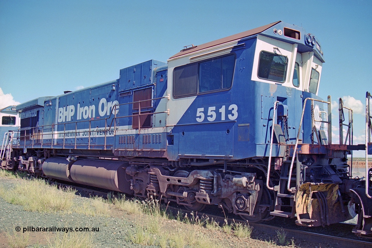 251-05
Nelson Point, BHP's recently retired Goninan WA ALCo C636 to GE C36-7M rebuild unit 5513 awaits its fate. Rebuilt in 1988 at Goninan's Welshpool factory from 1970 AE Goodwin built ALCo C636 with serial number G6012-2 and road number 5453 and assigned new serial number 4839-02 / 88-078. It was delivered in Mt Newman Mining orange and was named Kalgan. 22nd April 2000.
Keywords: 5513;Goninan;GE;C36-7M;4839-02/88-078;rebuild;AE-Goodwin;ALCo;C636;5453;G6012-2