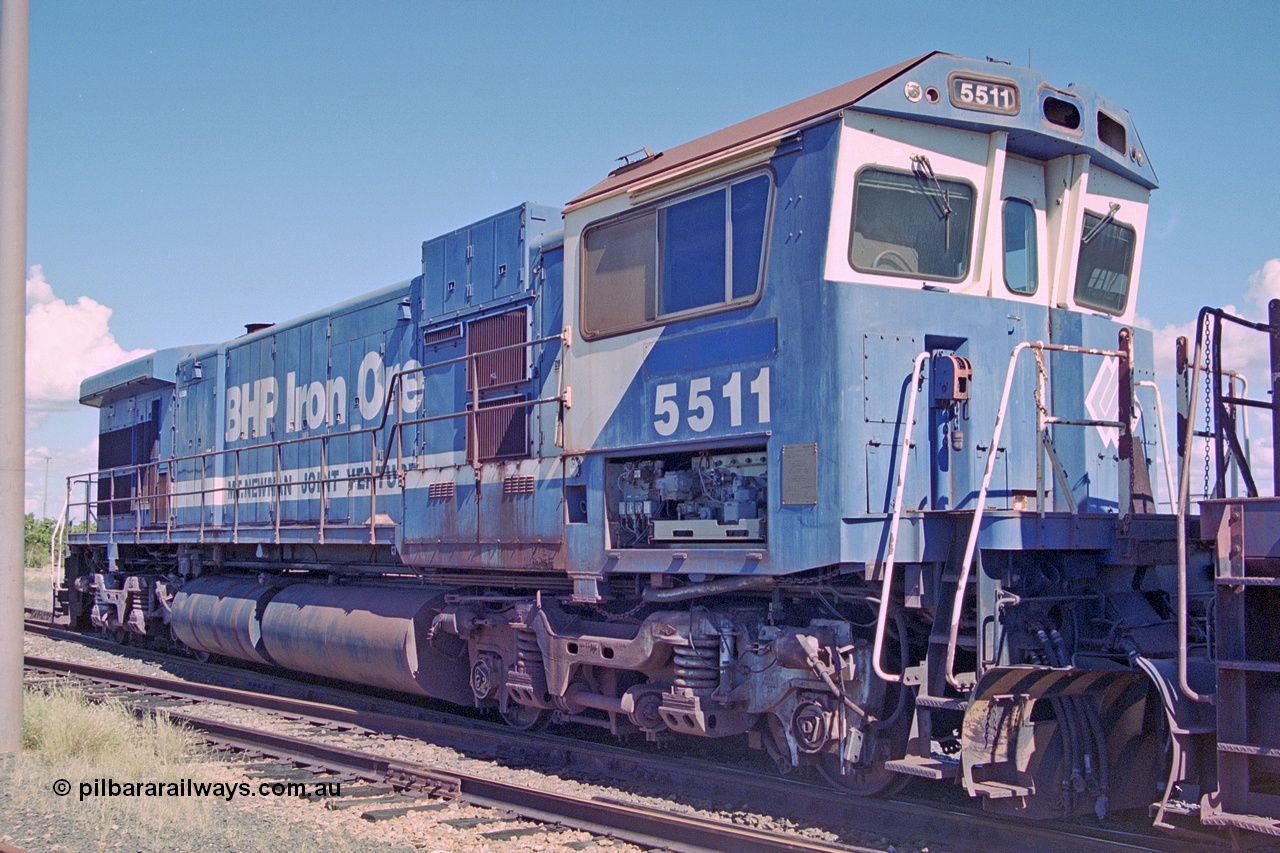 251-11
Nelson Point, BHP's recently retired Goninan WA ALCo C636 to GE C36-7M rebuild unit 5511 awaits its fate. Rebuilt in 1987 at Goninan's Welshpool factory from 1969 AE Goodwin built ALCo C636 with serial number G6035-4 and road number 5463 and assigned new serial number 4839-08 / 87-076. It was delivered in Mt Newman Mining orange and was named Port Hedland. 551 holds the dubious honour of being the first unit withdrawn following an engine failure in 1998. 22nd April 2000.
Keywords: 5511;Goninan;GE;C36-7M;4839-08/87-076;rebuild;AE-Goodwin;ALCo;C636;5463;G6035-4;