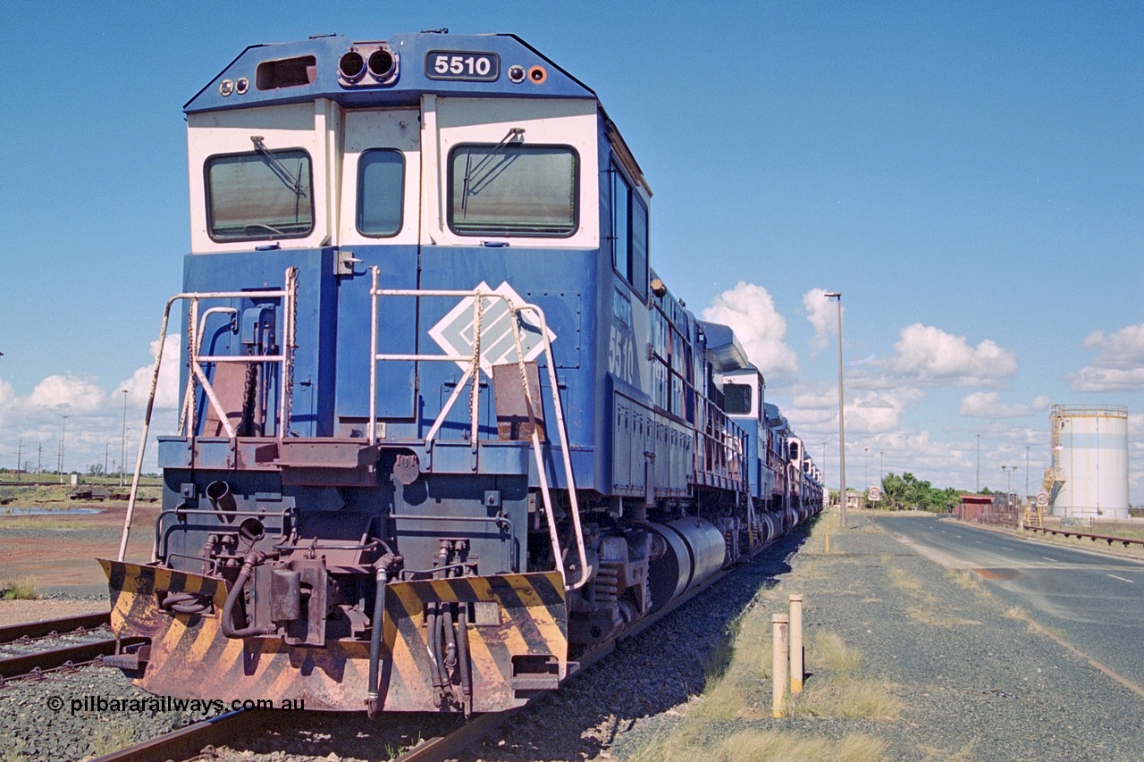 251-14
Nelson Point, BHP's retired Goninan WA's ALCo C636 to GE C36-7M rebuilds, these were the first time in the world that an ALCo C636 had been rebuilt into an GE C36-7, are lined up near the service shop awaiting their fate. The line is 5510, 5506, 5508, 5512, 5513, 5507, 5509, 5511, and, 5513. They had recently been displaced due to the arrival of the AC6000 units which also took their name plates. Only two units would go on to survive 5507 and 5508. 22nd April 2000.
Keywords: 5510;Goninan;GE;C36-7M;4839-07/87-075;rebuild;AE-Goodwin;ALCO;C636;5458;G6027-2;