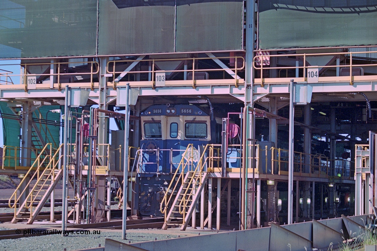 251-16
Nelson Point, the South Yard 'prep shed' located on the dumper exit roads 102, 103 and, 104. Goninan GE rebuild unit 5656 a CM40-8M unit with serial number 8412-01 / 94-147 sits on shed with a sister units. This facility was used to service and fuel locomotives while their respective waggon rakes were being tipped through the car dumpers. 22nd April 2000.
Keywords: 5656;Goninan;GE;CM40-8M;8412-01/94-147;rebuild;Comeng-NSW;ALCo;M636C;5494;C6084-10;