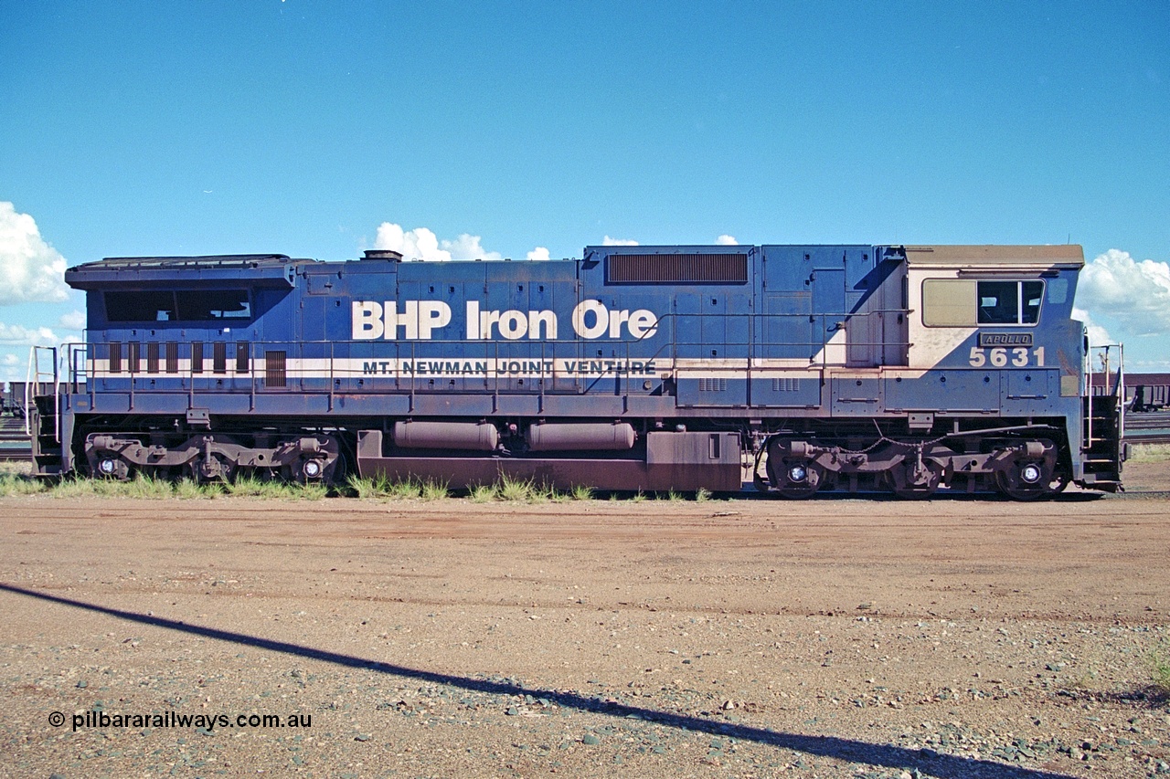 251-28
Nelson Point hard stand area, drivers side profile view of BHP's 5631 'Apollo' built new in October 1988 by Goninan as a GE CM39-8 model with serial number 5831-10 / 88-080. One of four such units built in 1988 and delivered in the Mt Newman orange livery. 22nd April 2000.
Keywords: 5631;Goninan;GE;CM39-8;5831-10/88-080;