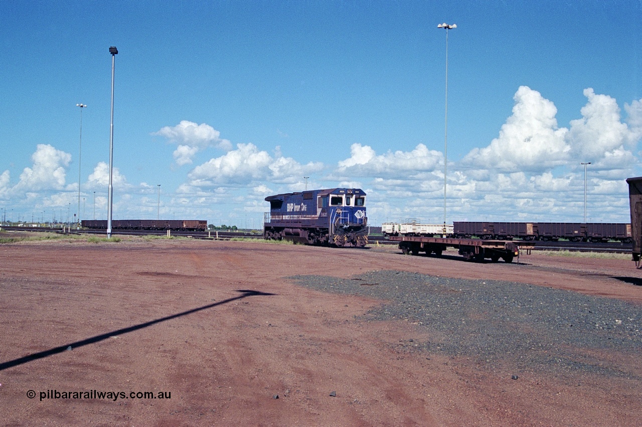 251-30
Nelson Point hard stand area overview sees the CM39-8 model loco 5631, an unidentified flat car and some ore waggons and a compressor set in the distance. 22nd April 2000.
