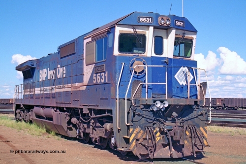 251-24
Nelson Point hard stand area, BHP's 5631 'Apollo' built new in October 1988 by Goninan as a GE CM39-8 model with serial number 5831-10 / 88-080. One of four such units built in 1988 and delivered in the Mt Newman orange livery. 22nd April 2000.
Keywords: 5631;Goninan;GE;CM39-8;5831-10/88-080;